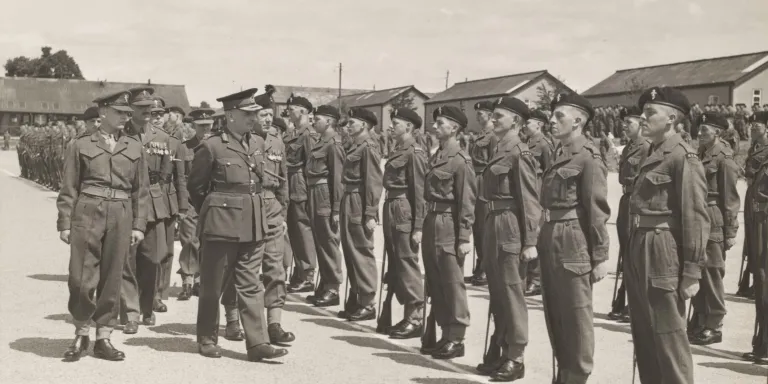 Major-General S W Joslin inspecting the passing out parade of ‘C’ Company, Royal Electrical and Mechanical Engineers, Honiton Camp, 1952