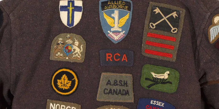 Some of the badges on Antony Mallaby's dressing gown, c1943