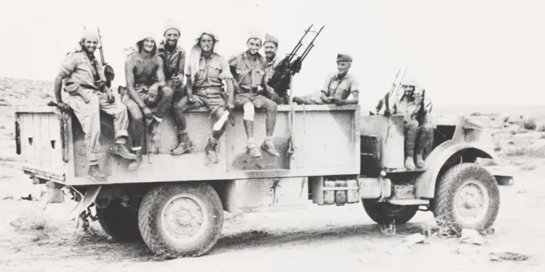 Long Range Desert Group lorry fitted with three sets of twin Vickers Class K-guns, c1942