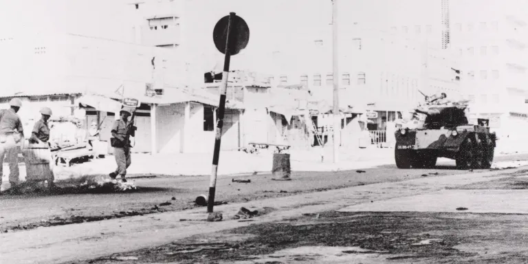 A Saladin armoured car patrols the Aden streets during a riot, 1967