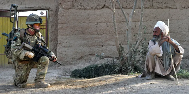 A soldier of the Royal Irish Regiment on patrol, Nad-e-Ali area, Helmand Province, Afghanistan, October 2010