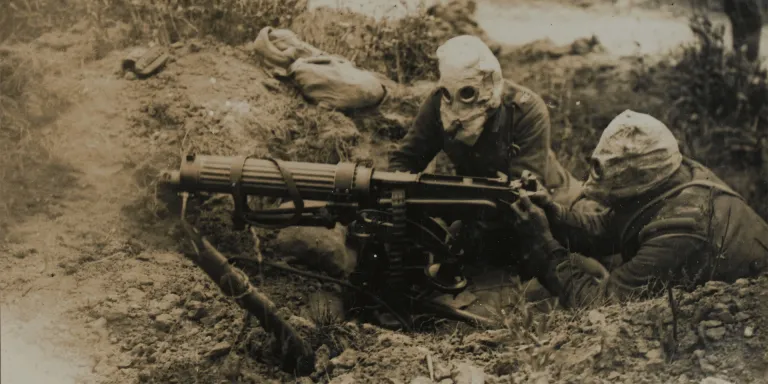 A Vickers machine-gun team in gas masks, c1916
