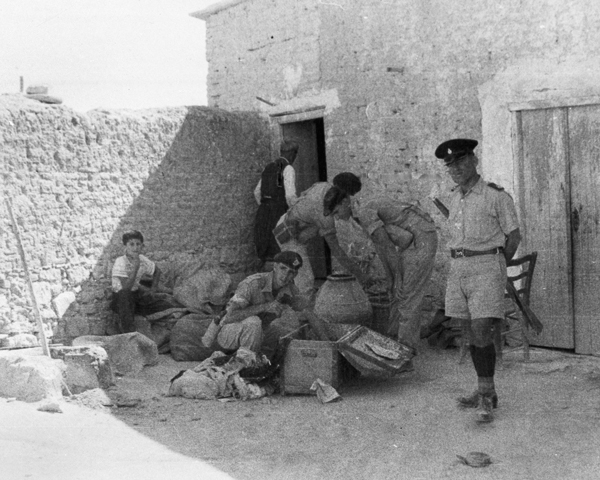 Soldier assisting the police during a house search, 1957