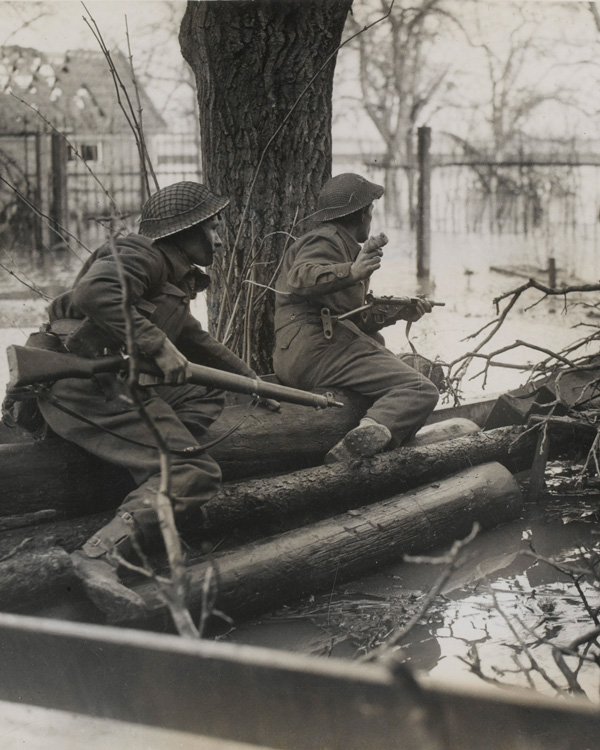 British infantry in action among the floods at Elst, south of Arnhem, 1944