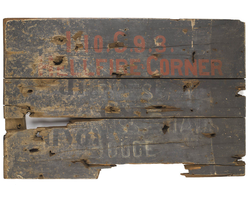 A wooden signboard taken from Hellfire Corner near Ypres