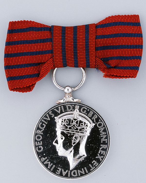 George Medal awarded to Margaret Richards of the ATS who risked her life giving first aid to soldiers wounded in an ammunition depot explosion, 1948