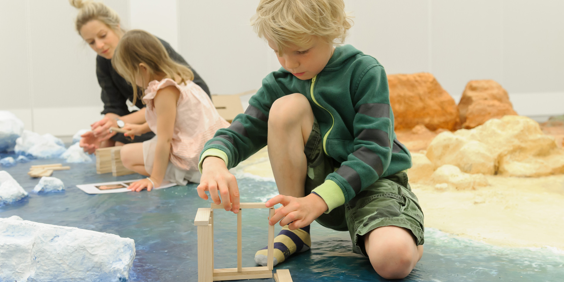 A child building with wooden blocks