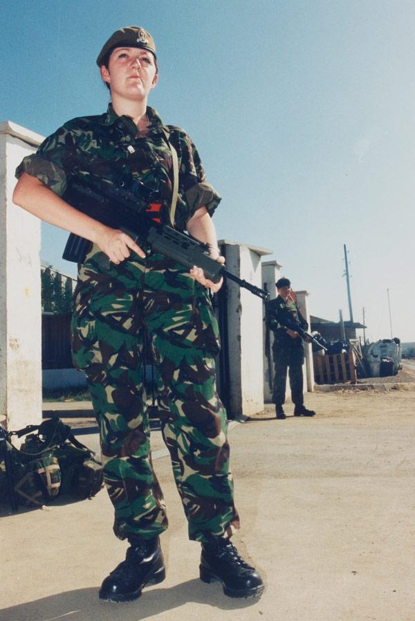 Private Leanne Jordan guarding the British Force Headquarters main gate, Kosovo, 1999