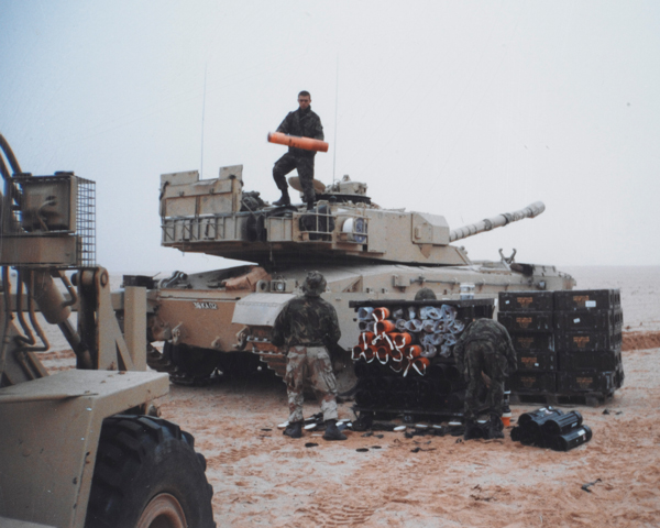 Re-arming a Challenger tank in the desert, 1991