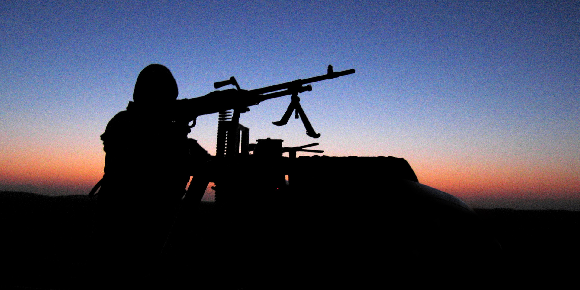 SAS soldier on a vehicle with mounted weapon