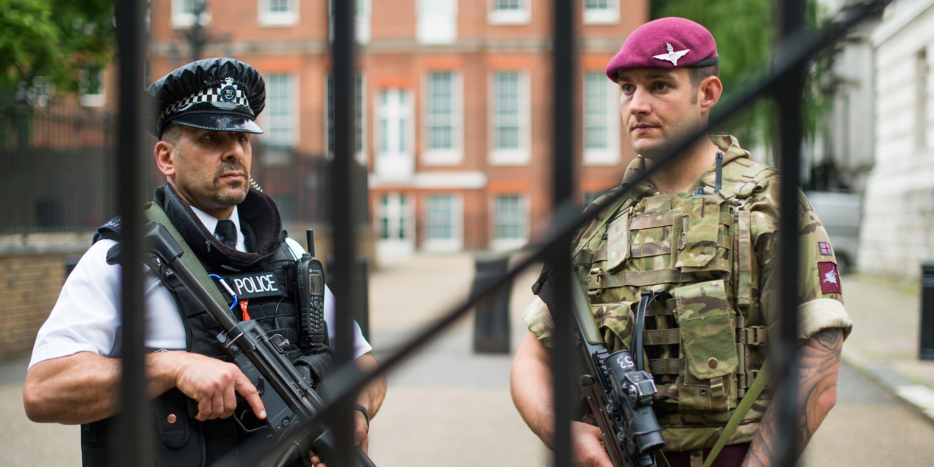 Soldier and policemen standing guard