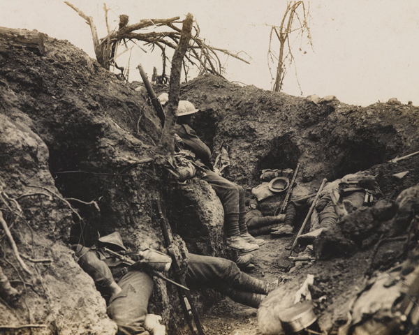 Soldiers of the Border Regiment resting in a front line trench, Thiepval Wood, August 1916