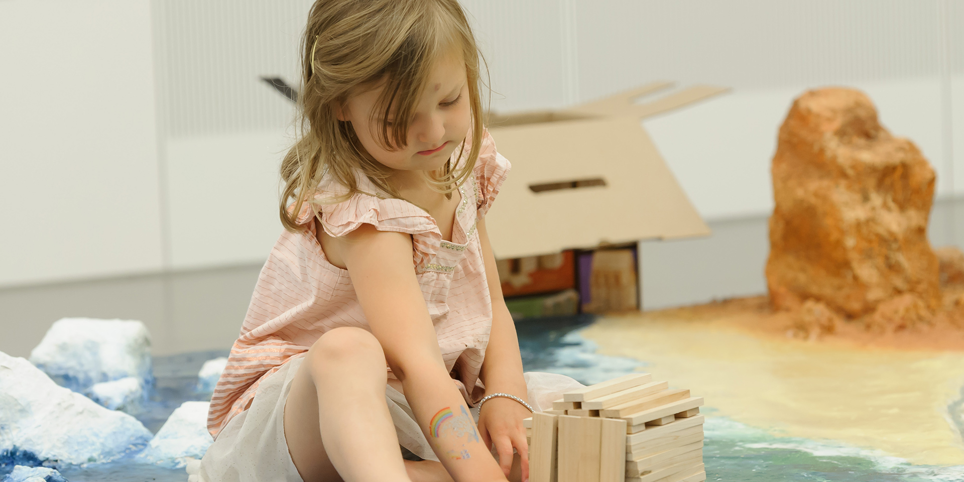 Child playing with construction blocks