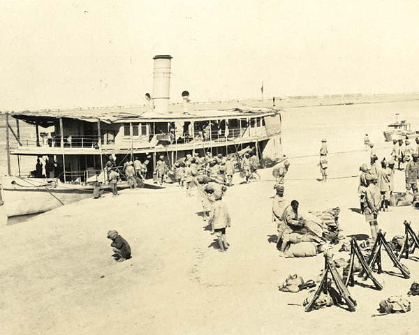 Troops disembarking from shallow-draught steamers, c1915 