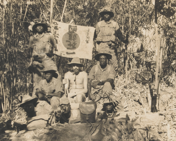 East African soldiers with a captured Japanese flag, 1944 