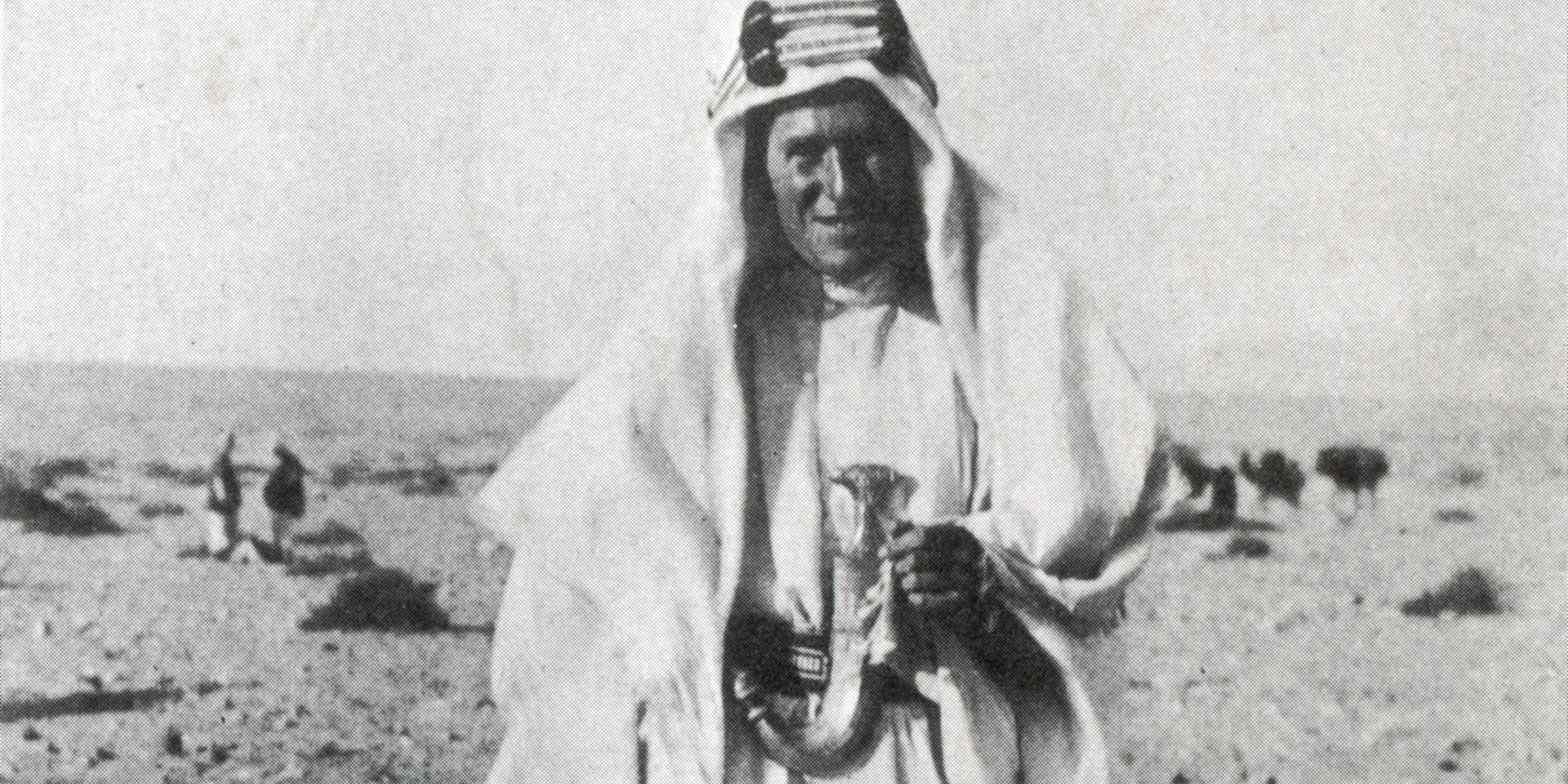 TE Lawrence in the desert in traditional Arab garb, c1917