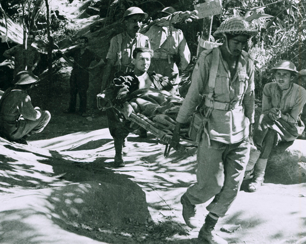 A wounded British soldier being evacuated, 1944 