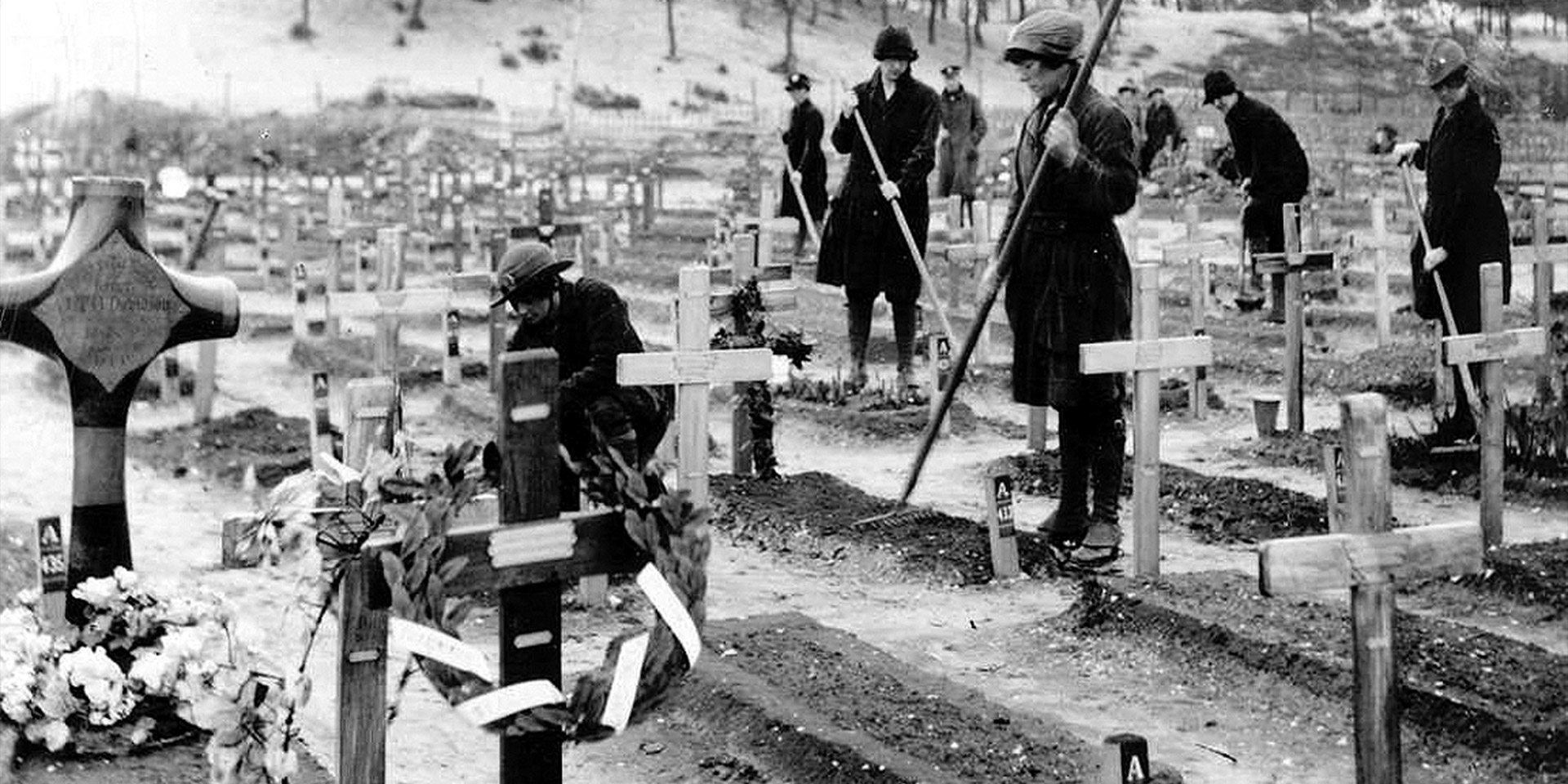 Members of Queen Mary’s Army Auxiliary Corps tending military graves, 1919