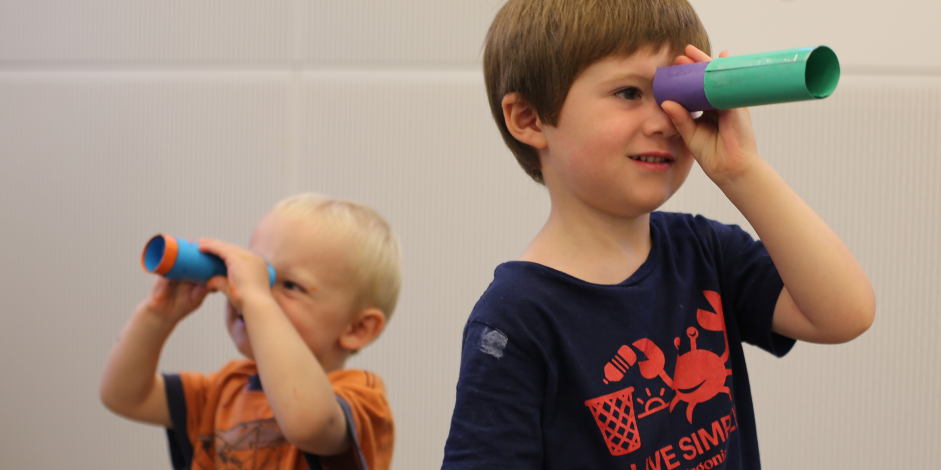 Children making telescopes out of cardboard