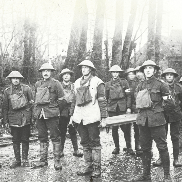 Stretcher bearers from the Sherwood Foresters (Nottinghamshire and Derbyshire Regiment) stand on a road in Fonquevillers, March 1917