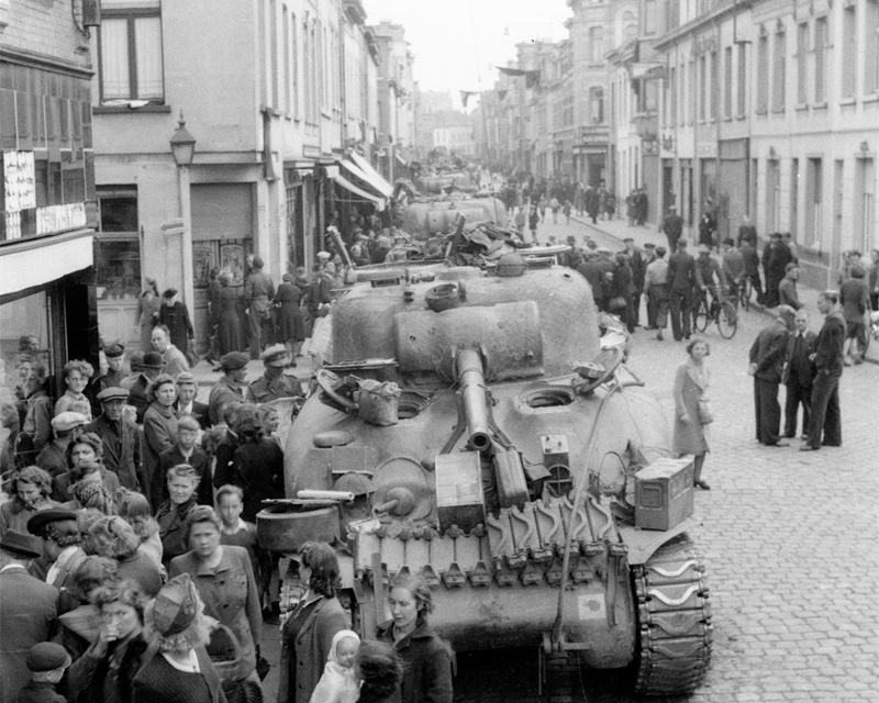 Civilians crowd around 3rd/4th County of London Yeomanry (Sharpshooters) tanks, Antwerp, 7 September 1944