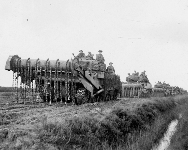 Men of the 2nd Argyll and Sutherland Highlanders hitch a ride on a flail tank, 1944