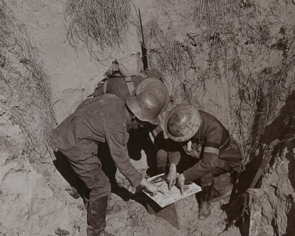 Officers interrogating a German prisoner captured during a raid, c1917 