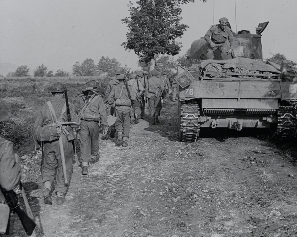 Infantry and tanks moving along a track towards the Hitler Line, Italy, May 1944