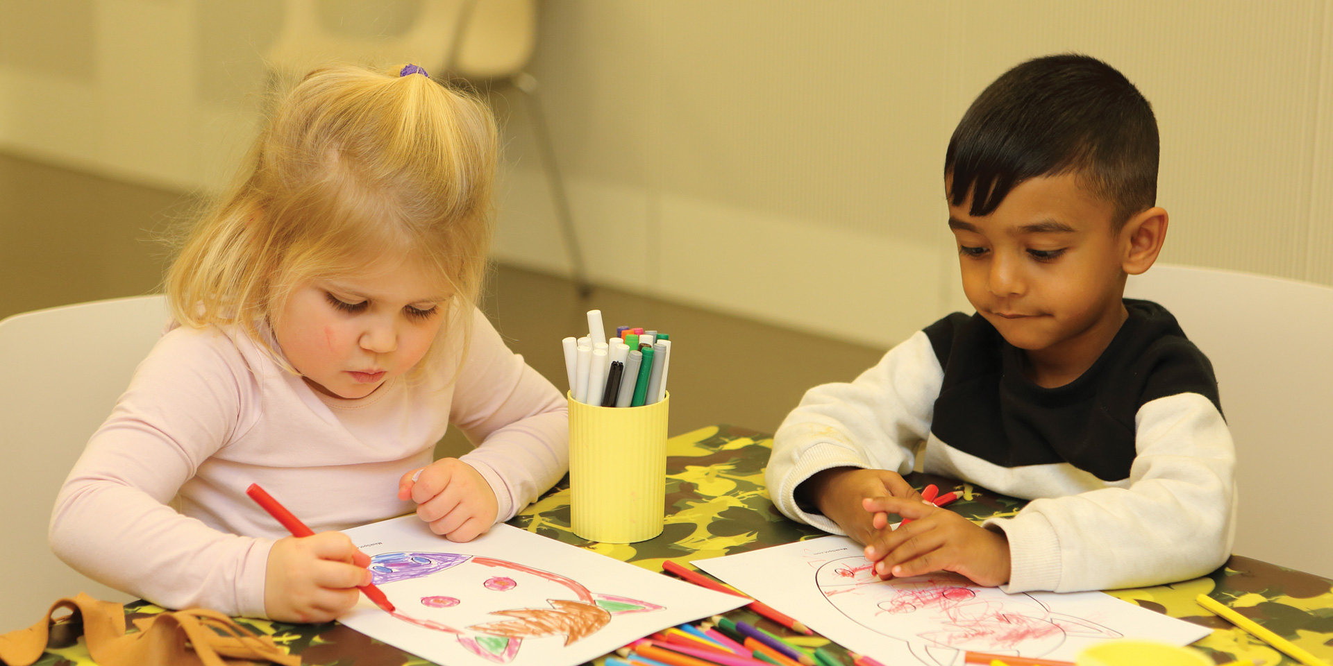 Children attending an arts and crafts workshop