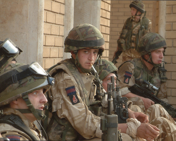 Irish Guards waiting to move out in support of a firefight, March 2003