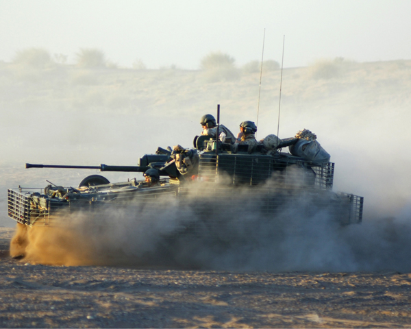 A Scimitar armoured vehicle from 1st The Queen's Dragoon Guards conducts a patrol near the Iran-Iraq border in north-east Maysan Province, 2006