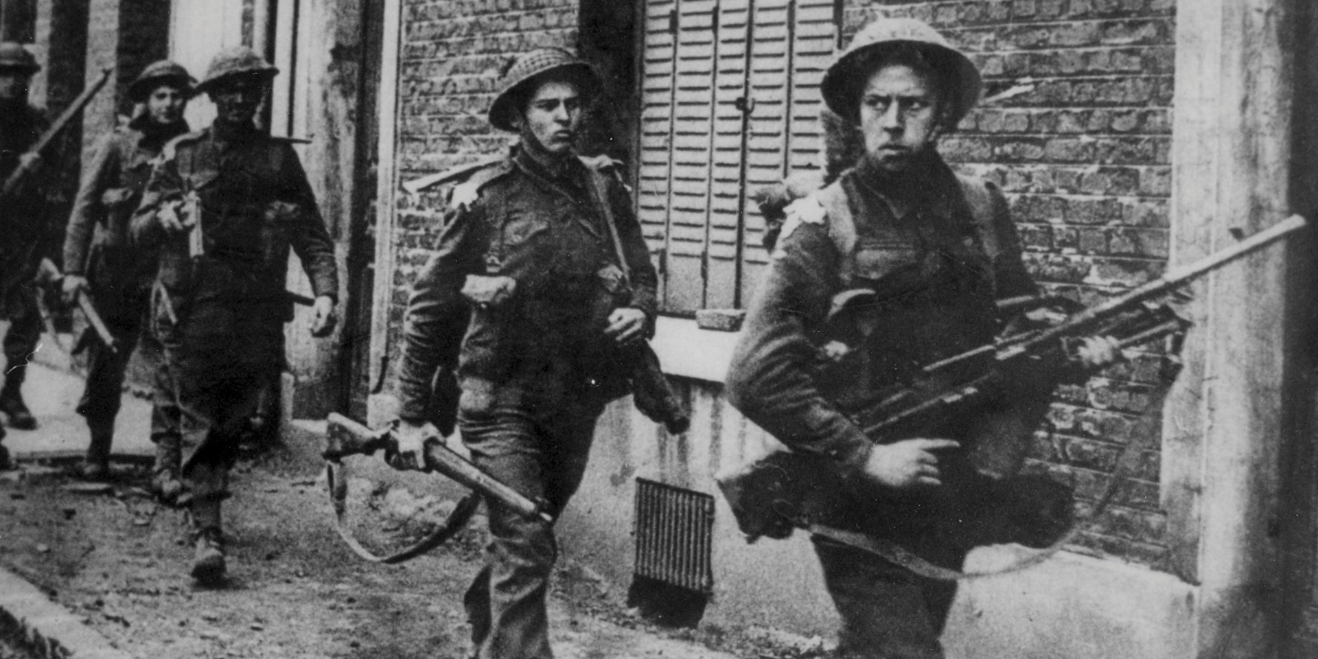 Infantry of the Coldstream Guards patrol through Arras, 1 September 1944