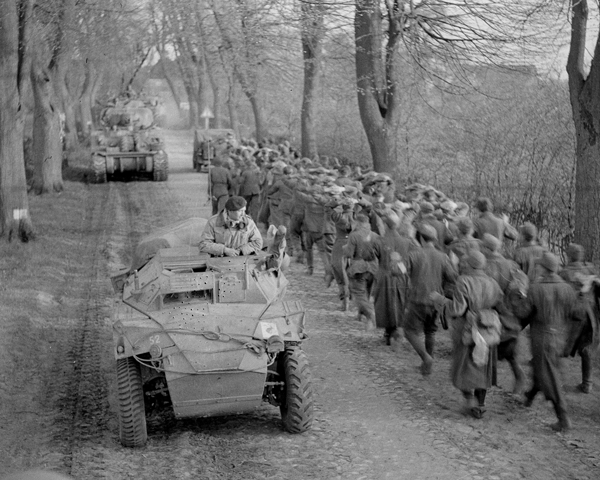Passing German prisoners of war when moving up to the Aller, Germany, April 1945