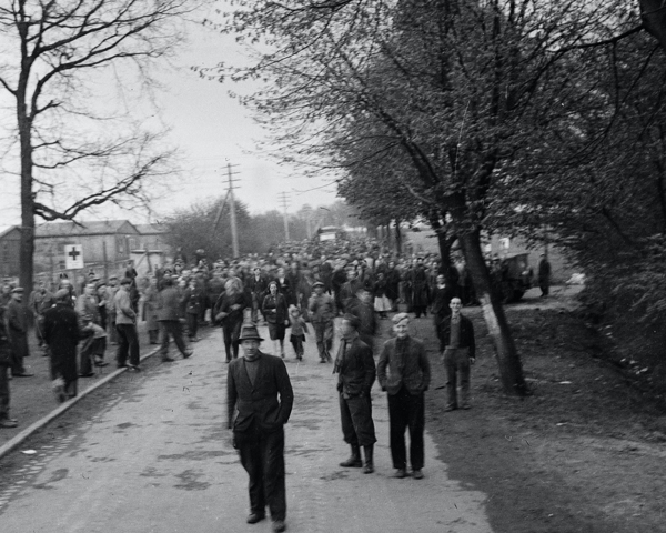 Recently liberated Poles outside a displaced persons camp, 1945