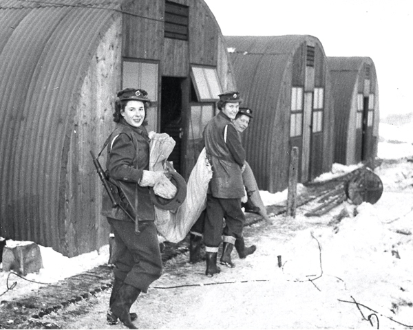 ATS women outside their Nissen huts, 1945