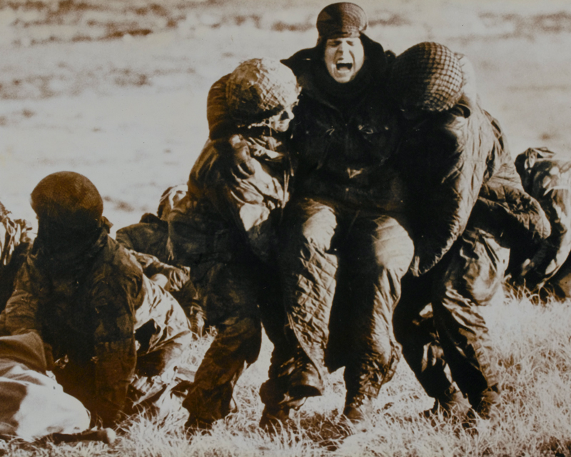 Troops evacuating wounded under fire, Mount Longdon, 1982