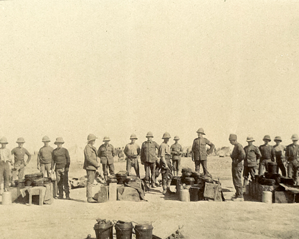 Troops from the Manchester Regiment stop for dinner during a march in Mesopotamia, c1917