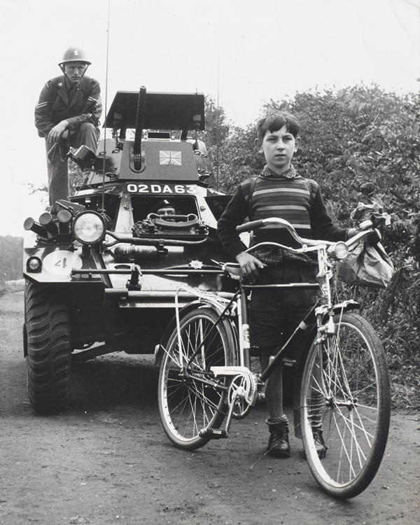 A British Army Ferret scout car and a schoolboy in West Berlin, 1961