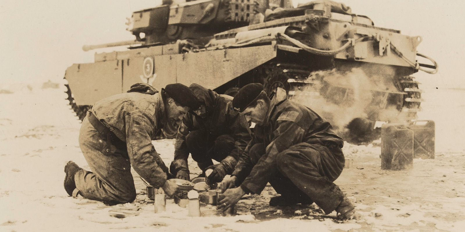 A tank crew from the 8th (King’s Royal Irish) Hussars make a meal during their service on the Imjin, 1951