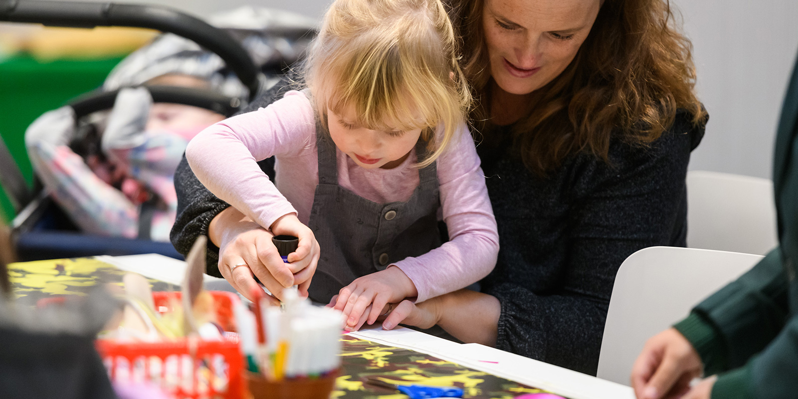 Mother and daughter involved in a craft workshop