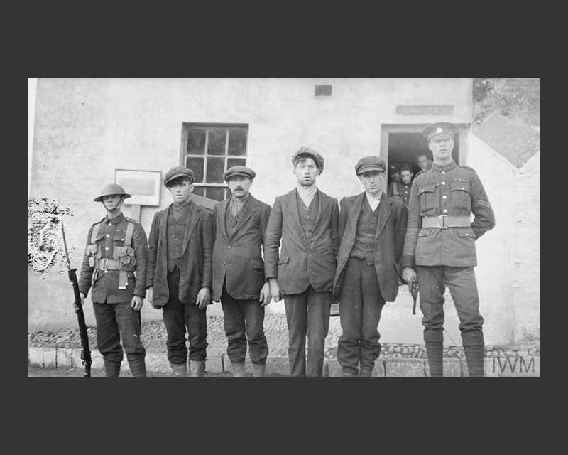 IRA suspects guarded by British soldiers at the Bandon Barracks, July 1920 
