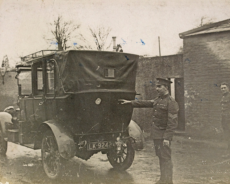 The car in which Lord French was ambushed, with a sergeant pointing out a bullet hole, 1919