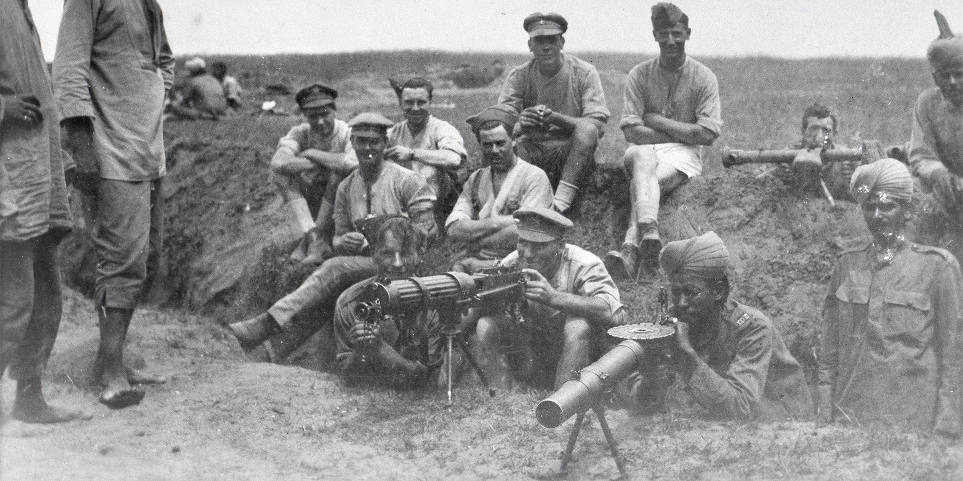 British and Indian machine gunners with a Vickers machine gun, Lewis gun and range-finder, 1917