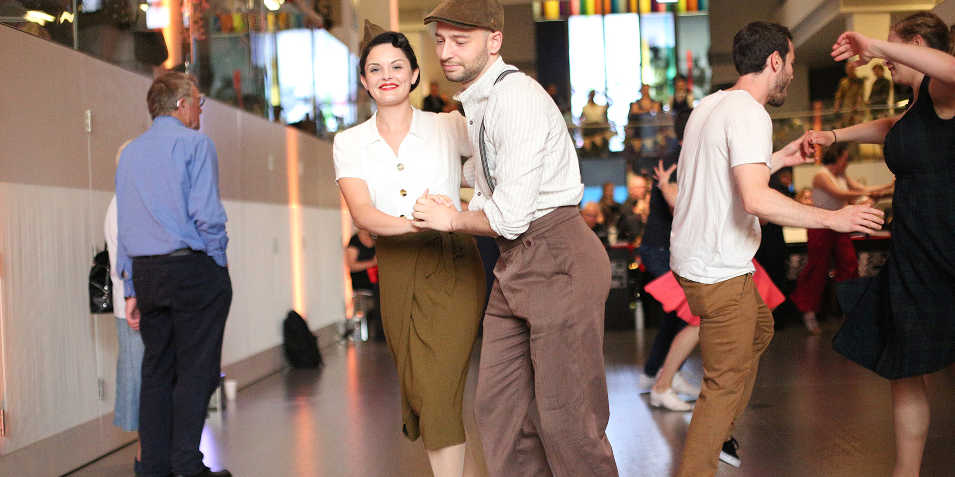 People dressed in 1940s style dancing at the National Army Museum