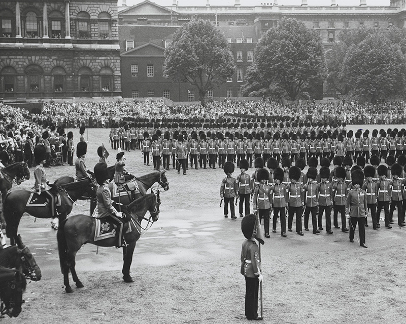 Queen Elizabeth II wearing the uniform of the Grenadier Guards takes the salute at Trooping the Colour, 1960