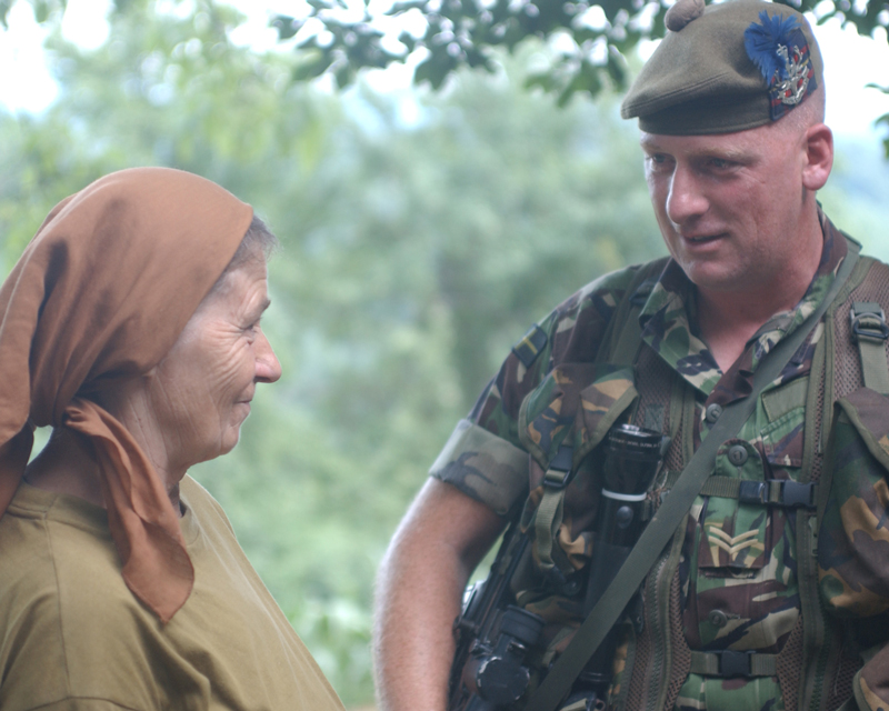 A corporal of The Highlanders meeting a local, Bosnia, 2003