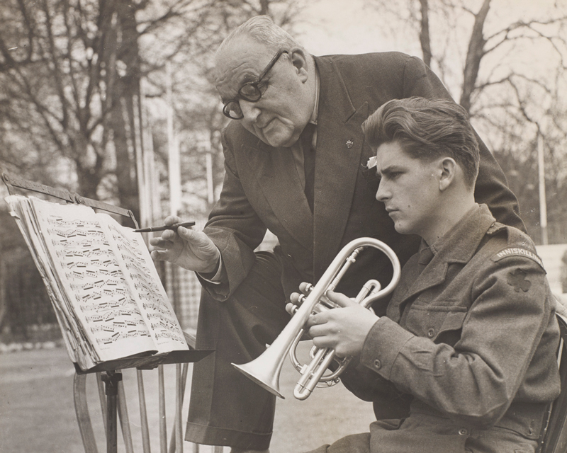 Instructing a cornet player at Kneller Hall, c1957