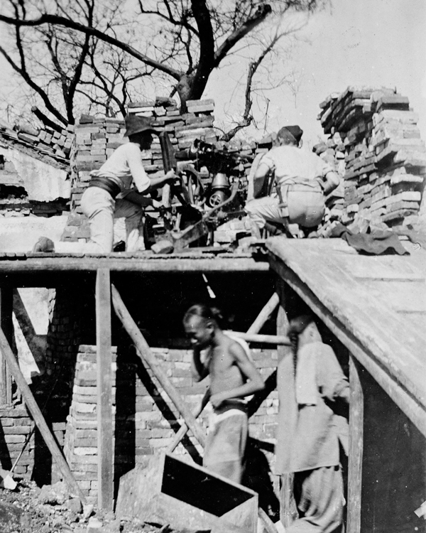 British and American troops man a Colt machine gun, Legation Quarter, 1900 