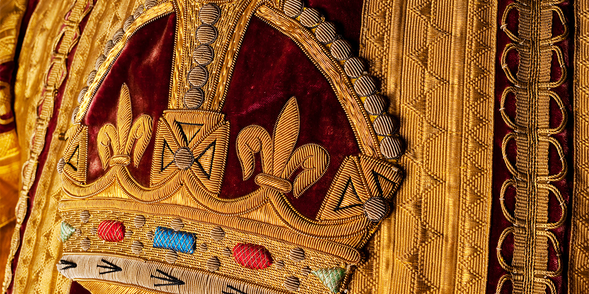 Detail of embroidered crown on State Trumpeter's coat, c1911