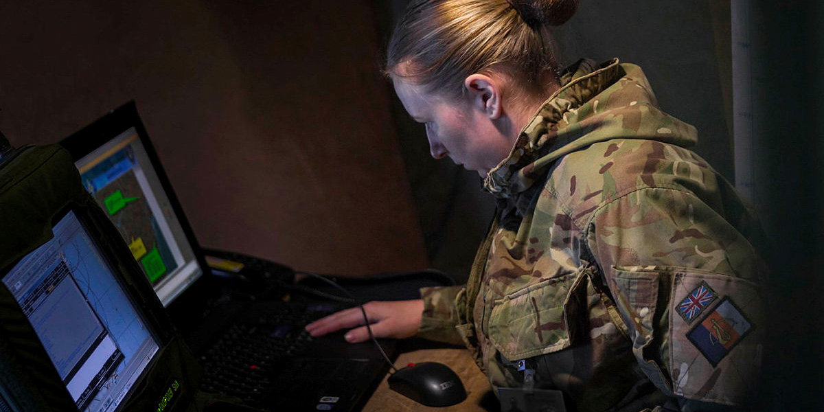 Soldier working at her laptop, Exercise Citadel Guibert, 2018